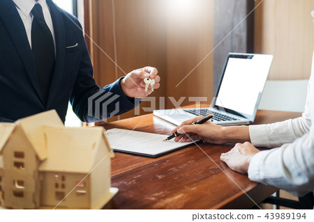 agent getting keys to customer new house, hand of real estate ag 43989194