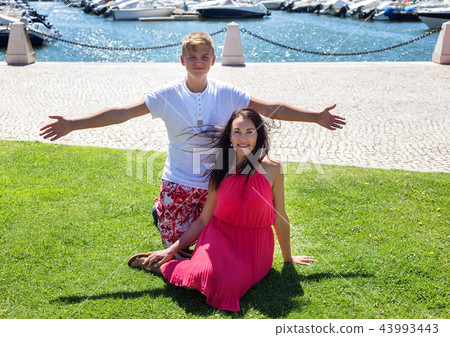 Girl and son in the park of the city of Faro, rest on the grass. Girl and son in the park of the city of Faro, rest on the grass. 43993443