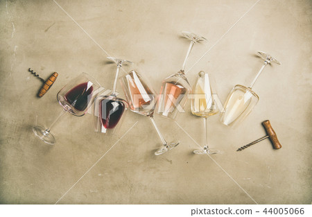Red, rose and white wine in glasses and corkscrews 44005066