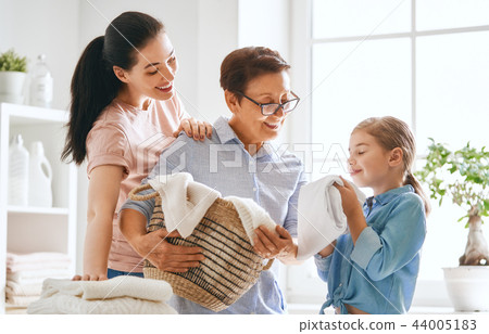 family doing laundry at home family doing laundry at home 44005183