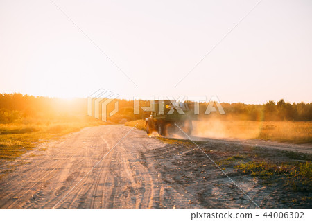 Truck Transporting Garbage On Country Sandy Road During Sunset S Truck Transporting Garbage On Country Sandy Road During Sunset S 44006302
