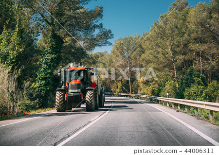 Tractor With Fertilizer Applicator With Tank In Motion On Countr 44006311