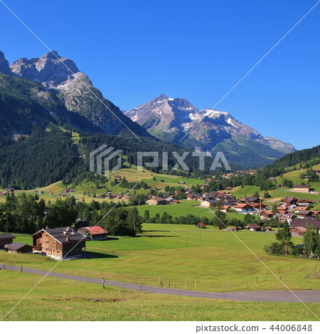 Village Gsteig bei Gstaad and Mount Oldenhorn. Village Gsteig bei Gstaad and Mount Oldenhorn. 44006848