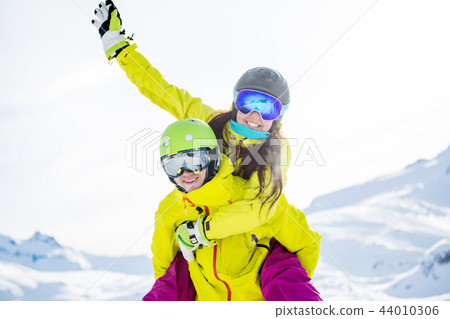 Photo of Funny sporty woman and man against backdrop of mountains Photo of Funny sporty woman and man against backdrop of mountains 44010306
