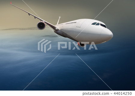 Commercial airplane flying above clouds. Commercial airplane flying above clouds. 44014250