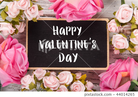 Small chalkboard for Valentine's day. Background with pink roses. Small chalkboard for Valentine's day. Background with pink roses. 44014265