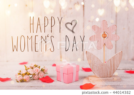 Flowers composition for Women's Day. Pink flowers on old white wooden background. 44014382