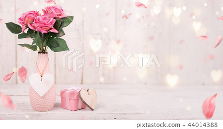 Flowers composition for Valentine's, Mother's or Women's Day. Pink flowers on old white wooden background. 44014388