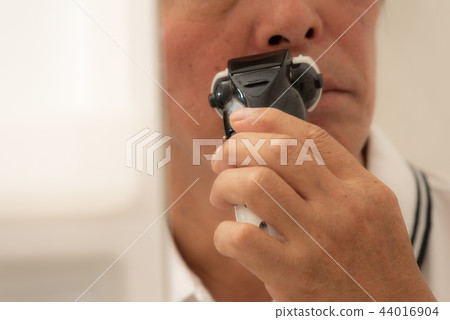 Shaving towards middle age man mirror 44016904