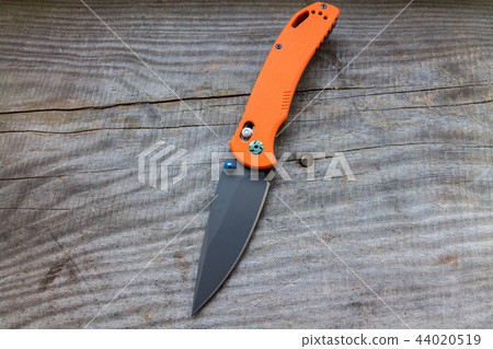 Knife on a wooden background. Knife diagonally. 44020519