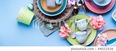 Tableware dish set on blue pastel background Tableware dish set on blue pastel background 44022816