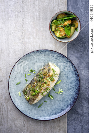 Fried cod fish fillet with vegetable 44024933