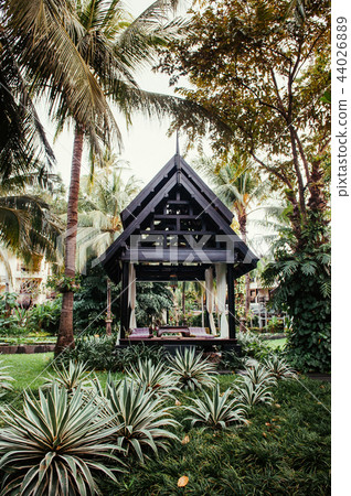 Thai pavilion in lush tropical garden with agave Thai pavilion in lush tropical garden with agave 44026889