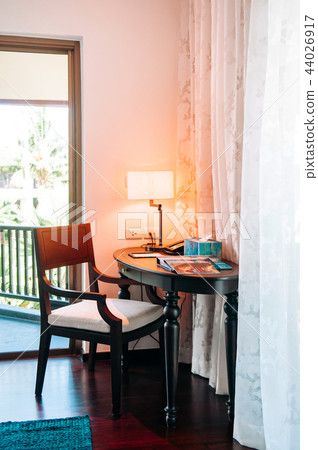 Living room with vintage wooden chair and table Living room with vintage wooden chair and table 44026917