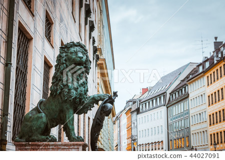 Lion on Street in Munich old town near St. Michael's Church Lion on Street in Munich old town near St. Michael's Church 44027091