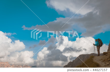 hiker on footpath Sella Ronda mountain south Tyrol 44027157