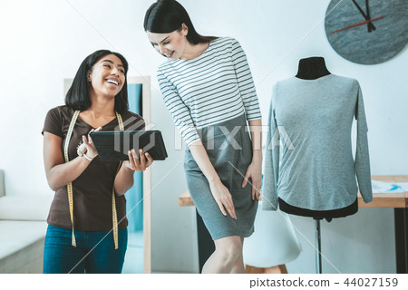 Happy girls working together in salon 44027159