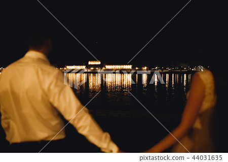 Luxury married wedding couple, bride and groom posing in luxury city Luxury married wedding couple, bride and groom posing in luxury city 44031635