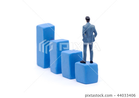 Miniature businessman and graph  44033406