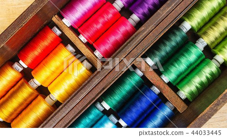 Spool of threads in the old wooden box Spool of threads in the old wooden box 44033445