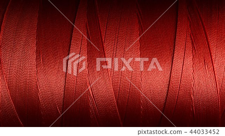 Macro picture of red color thread texture 44033452