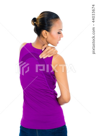 Woman rubbing aching back Woman rubbing aching back 44033674