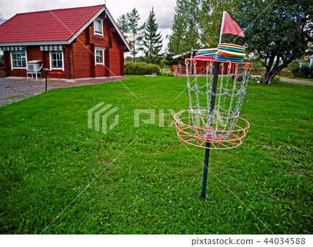 Disk in a disk golf basket 44034588