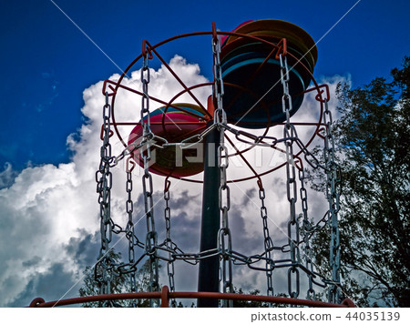 Disk in a disk golf basket Disk in a disk golf basket 44035139