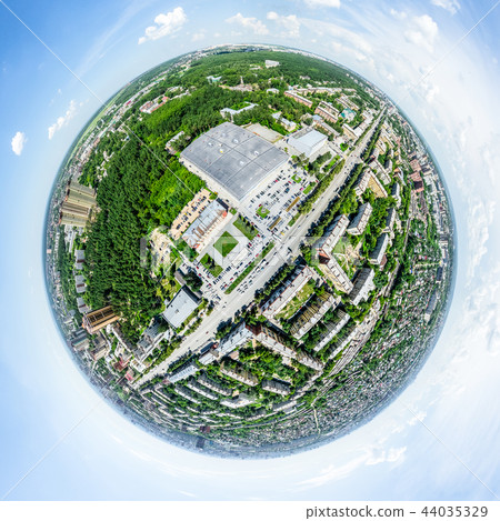 Aerial city view with crossroads and roads, houses, buildings, parks and parking lots. Sunny summer Aerial city view with crossroads and roads, houses, buildings, parks and parking lots. Sunny summer 44035329