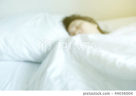 Abstract blur woman sleeping on the bed Abstract blur woman sleeping on the bed 44036004
