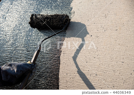 industrial worker on construction site laying sealant industrial worker on construction site laying sealant 44036349
