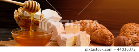 slices of cheese brie or camembert with croissants 44036372