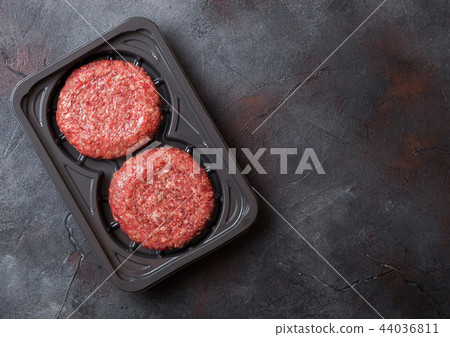 Plastic tray with raw minced home made grill beef  44036811