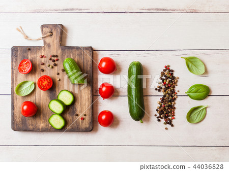 Organic Tomatoes and cucumbers with basil  44036828