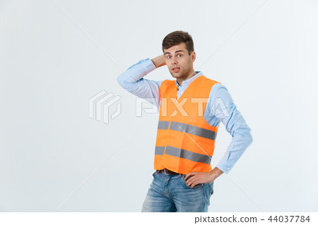 Serious engineer standing with looking away studio shot isolated on white. Serious engineer standing with looking away studio shot isolated on white. 44037784