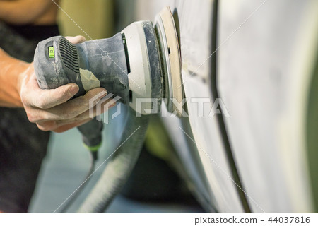 Mechanic working in auto shop. 44037816