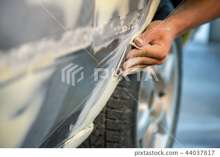 Mechanic working in auto shop. 44037817