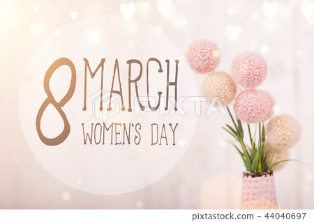 Flowers composition for Women's Day. Pink flowers on old white wooden background. 44040697