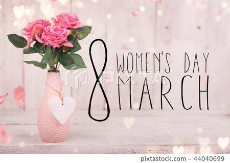 Flowers composition for Women's Day. Pink flowers on old white wooden background. Flowers composition for Women's Day. Pink flowers on old white wooden background. 44040699