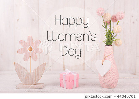 Flowers composition for Women's Day. Pink flowers on old white wooden background. Flowers composition for Women's Day. Pink flowers on old white wooden background. 44040701