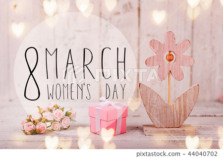 Flowers composition for Women's Day. Pink flowers on old white wooden background. 44040702