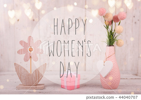 Flowers composition for Women's Day. Pink flowers on old white wooden background. Flowers composition for Women's Day. Pink flowers on old white wooden background. 44040707
