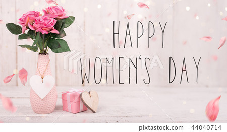 Flowers composition for Women's Day. Pink flowers on old white wooden background. 44040714