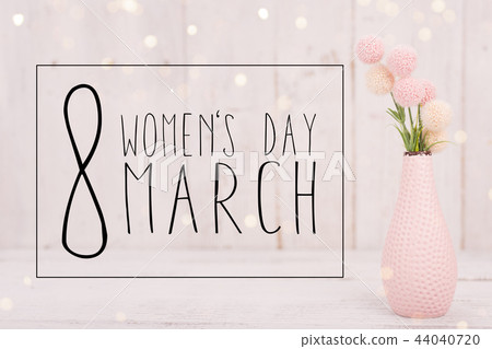 Flowers composition for Women's Day. Pink flowers on old white wooden background. 44040720