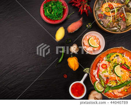 Various of asian meals on rustic background , top view , place for text. Various of asian meals on rustic background , top view , place for text. 44040789
