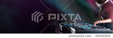 Dj mixes the track in the nightclub at a party 44040808