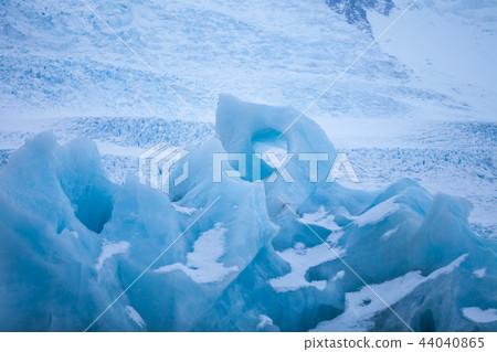 Icebergs swimming on frozen water, close-up. Icebergs swimming on frozen water, close-up. 44040865