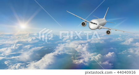 Commercial airplane flying above clouds. Commercial airplane flying above clouds. 44040916