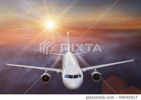 Commercial airplane flying above clouds. Commercial airplane flying above clouds. 44040917