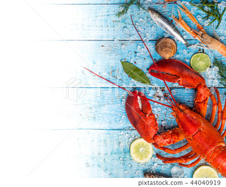 Fresh tasty seafood served on old wooden table. Fresh tasty seafood served on old wooden table. 44040919